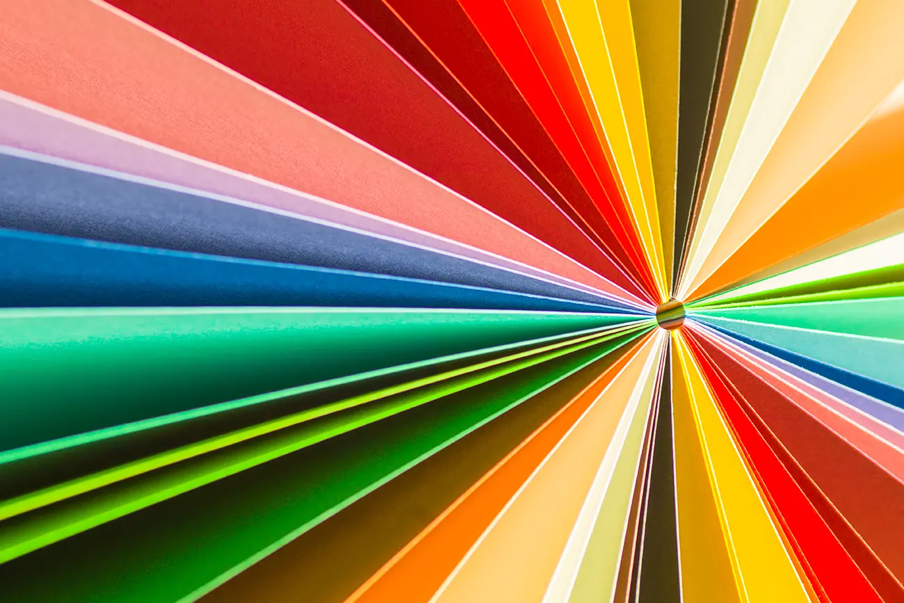Rainbow colored paper arranged in a starburst pattern to signify the revolution of the digital publishing industry.